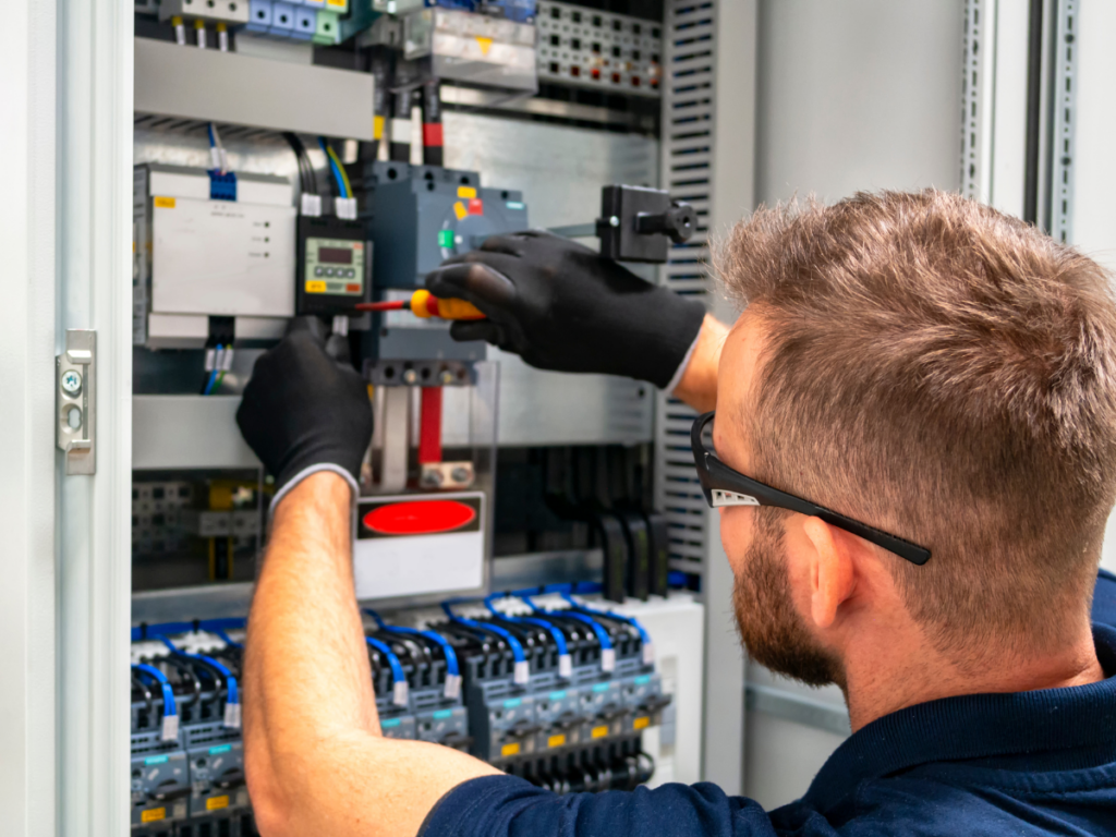electrician working on breaker box Best Home Services 