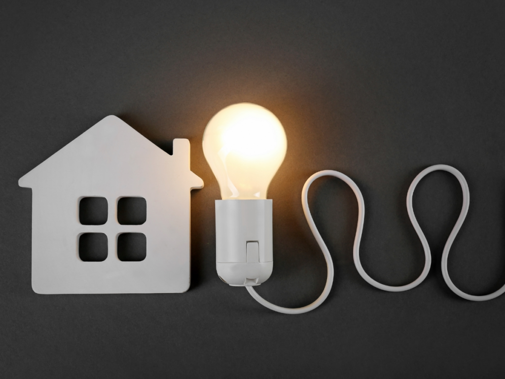 white home icon with lit light bulb Best Home Services 
